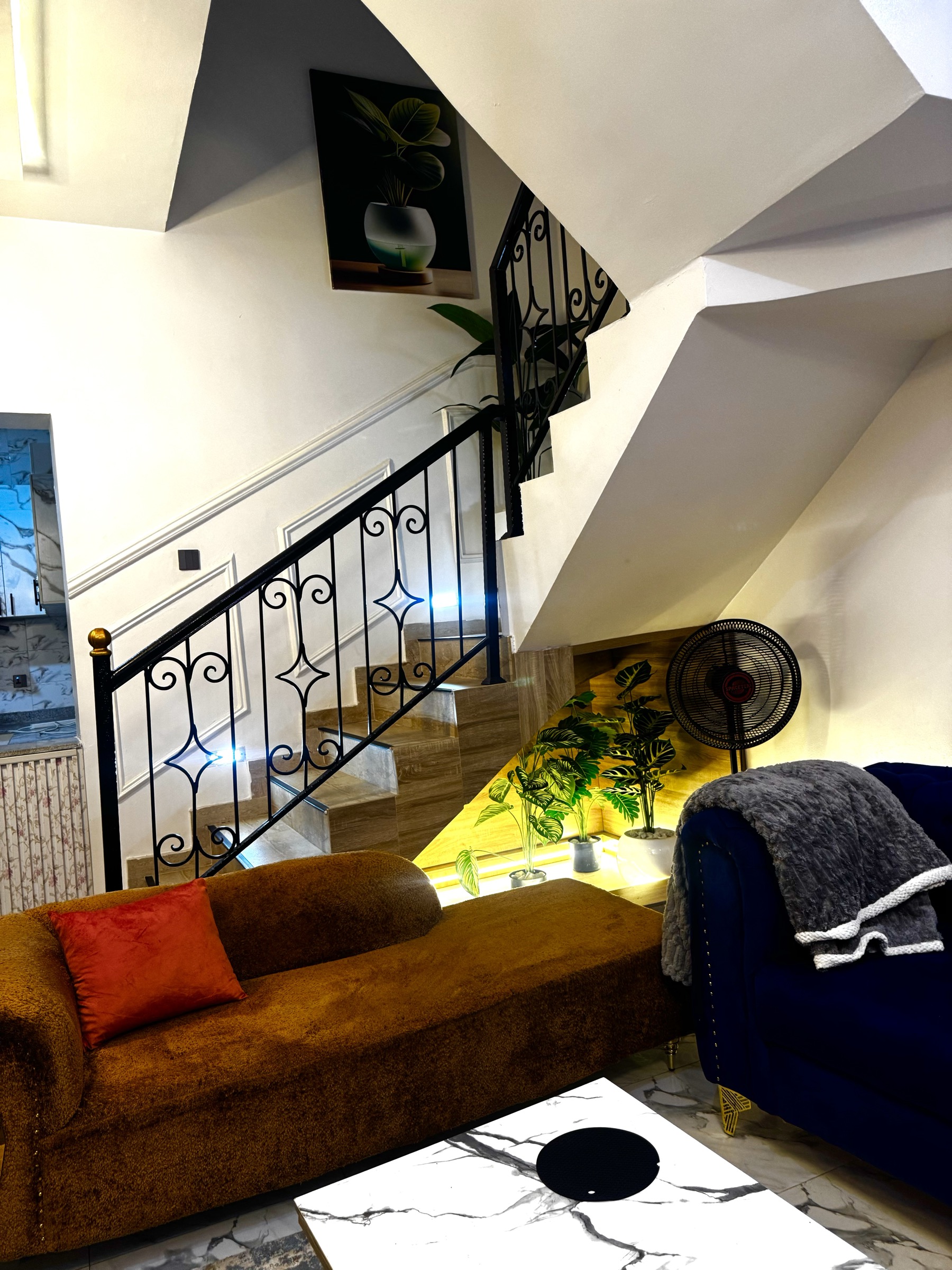 Elegant duplex living room with staircase